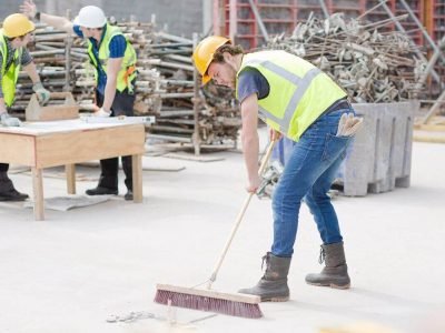 construction-worker-sweeping-at-construction-site